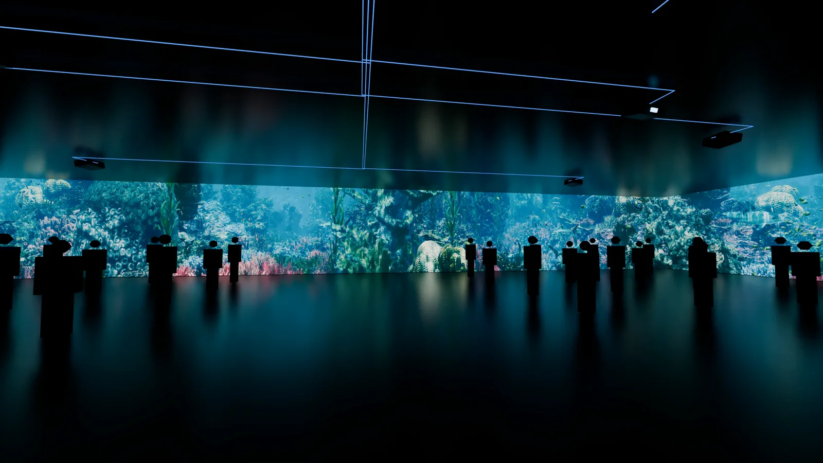 An audience inside a room whose walls are wrapped in one continuous projected reef.